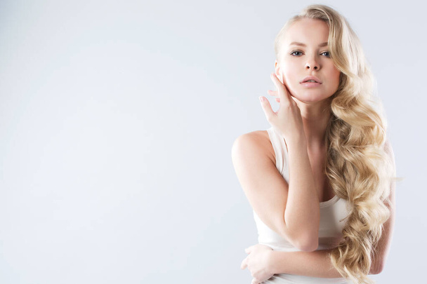 Portrait of beautiful blonde luxuriant hair curling. Health and Beauty. - Фото, зображення