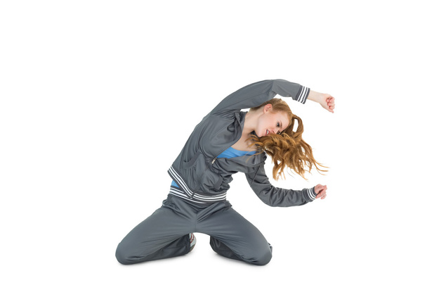 Young woman in sportswear stretching - Photo, Image