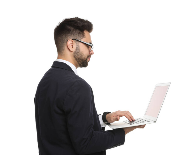Young businessman with laptop on white background - Photo, Image