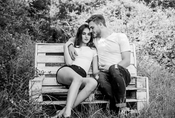 valentines day. summer camping in forest. couple in love. Casual fashion. man with girl in park. family rancho weekend. romantic date. couple relax outdoor on bench. Togetherness. Happy to be in love - Valokuva, kuva