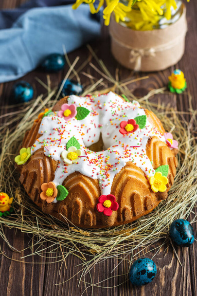 Easter cake. Kulich cake on a rustic background. Cake for celebration. Easter concept - Zdjęcie, obraz