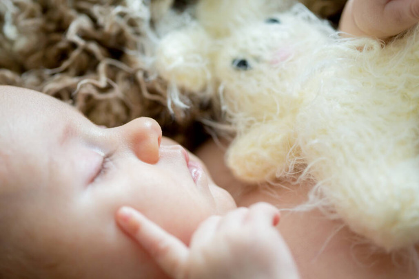 Close portrait of newborn baby girl in studio - Fotó, kép
