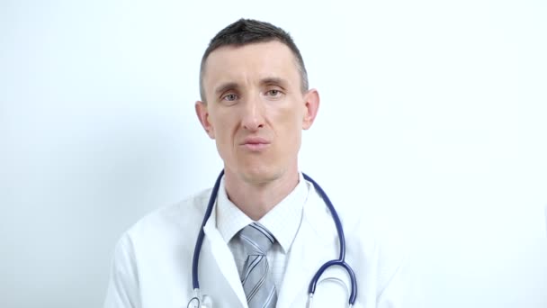 A man doctor consults a patient in a online video chat. - Felvétel, videó
