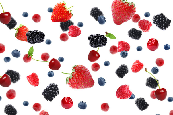 Set of falling sweet berries on white background - Фото, зображення