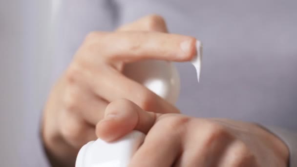 close up of woman applying moisturizing hand cream - Materiaali, video