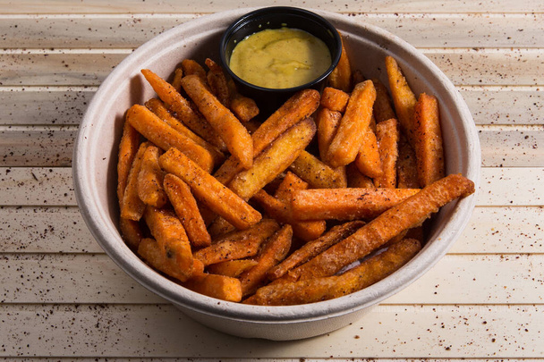 Freshly cooked French fries baked with paprika - Foto, Imagen
