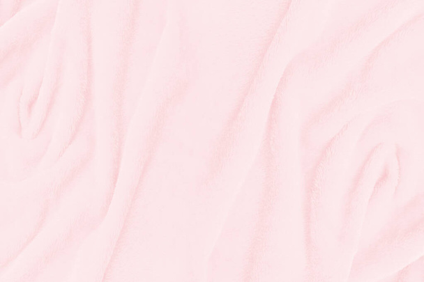 柔らかいピンクの生地のテクスチャの背景。壁紙や背景のための抽象的な布シルク - 写真・画像