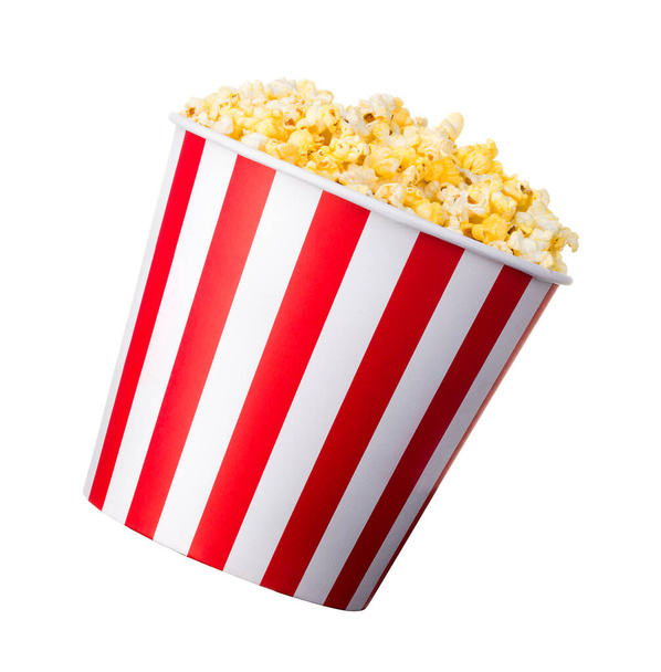 Paper striped bucket with popcorn isolated on white background - Foto, imagen