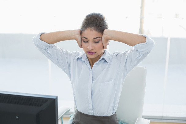 Businesswoman suffering from headache at office - Valokuva, kuva