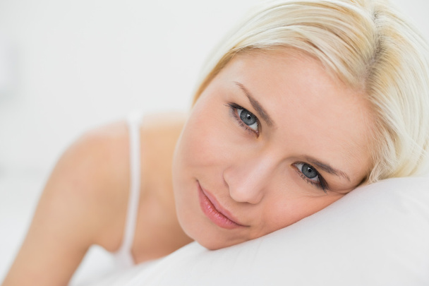Close up portrait of a beautiful blond in bed - Photo, Image