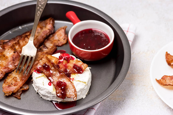 Roasted or Baked Camambert or Brie Cheese Baked with Bacon and Served with Cranberries Jam Keto Diet - Photo, Image