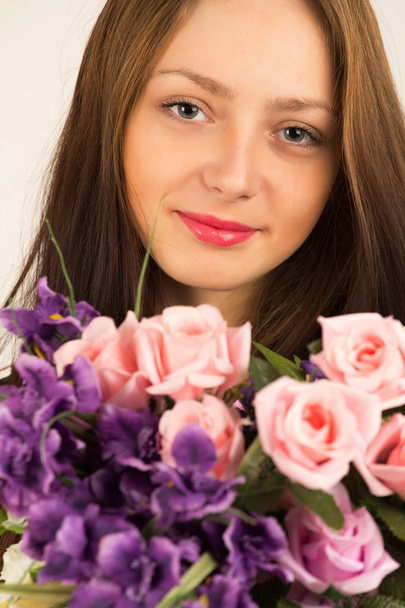 Young woman with flowers - Photo, Image