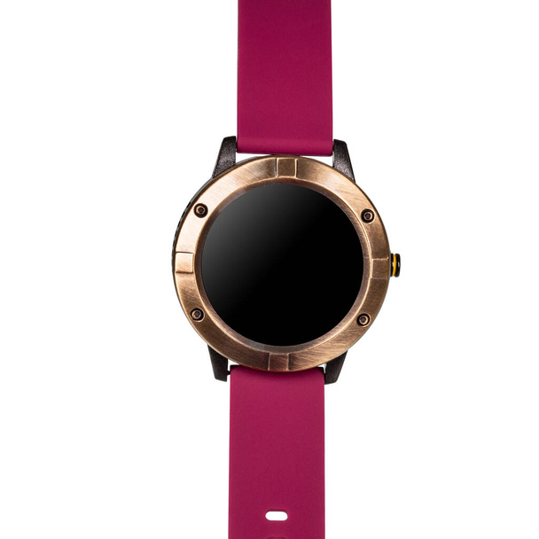 Drahtlose Smartwatch in einem runden, matten Bronzegehäuse und einem roten Silikonarmband auf weißem Hintergrund. Frontansicht - Foto, Bild