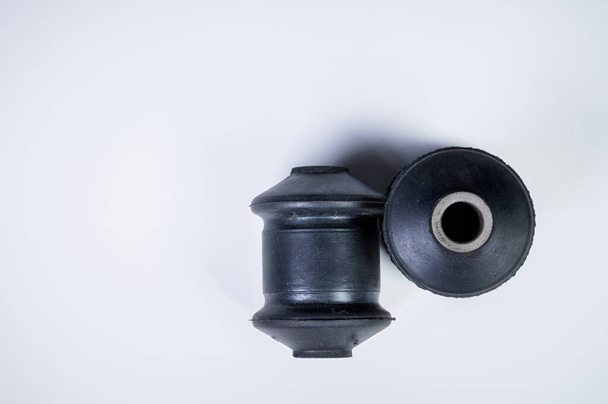 New spare parts for car suspension. A pair of silent blocks pendants on a gray gradient background - Fotografie, Obrázek