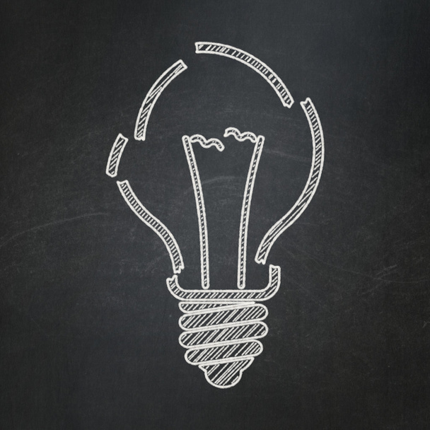 Business concept: Light Bulb on chalkboard background - Foto, afbeelding
