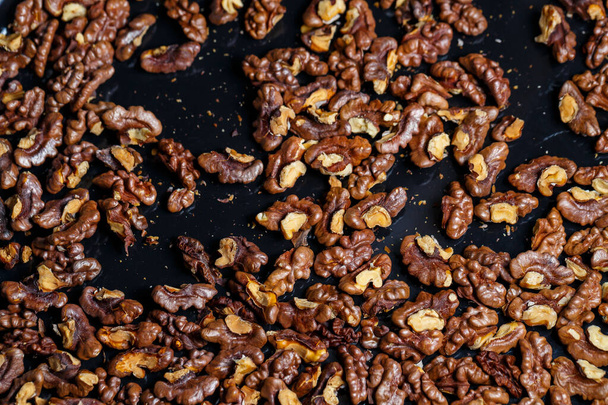 Roasted walnuts. Nuts help the brain work. Fatigue Food, Healthy Nuts. Superfood, vegan, vegetarian food concept. Macro of walnut texture, selective focus. Healthy snac - Photo, Image