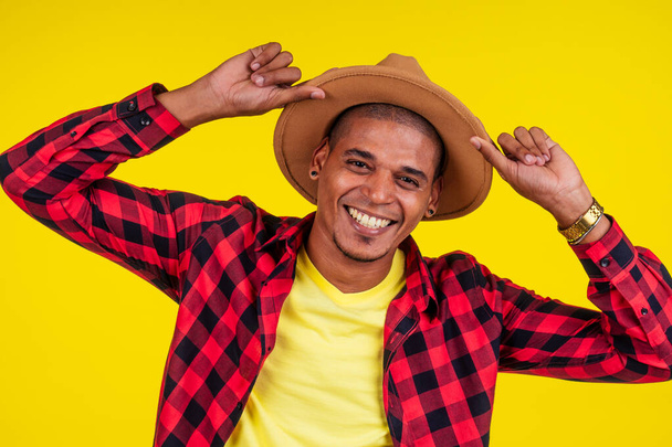 arabic brazilian man posing at studio in yellow background - Photo, Image