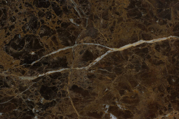 The texture of natural brown marble with light veins is called Emperador Dark. - Foto, afbeelding