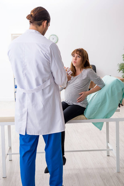 Young woman visting young male doctor gynecologist - Photo, Image
