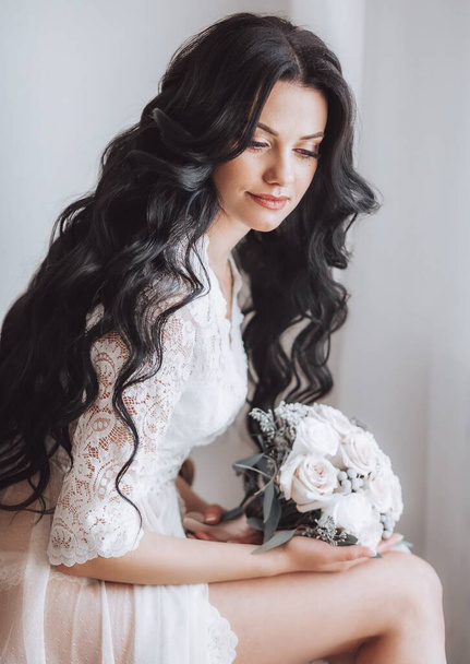 Beautiful young bride in nightgown before wedding at home   - Fotografie, Obrázek