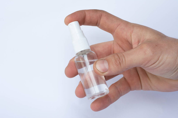 Hand with an antiseptic. Spray antiseptic. Antibacterial and disinfectant in a bottle - Photo, Image