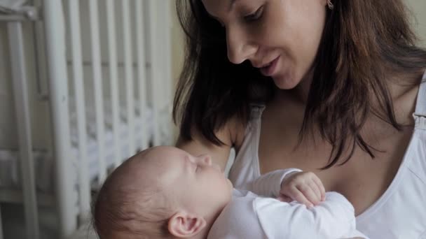 Mother Sings Lullaby To Her Newborn Baby So That He Falls Asleep And Kisses Him - Felvétel, videó