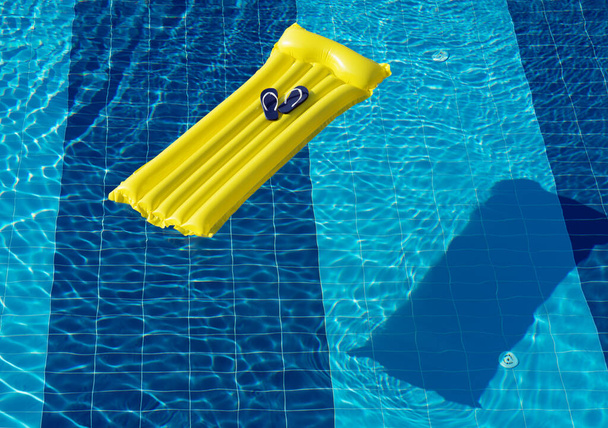 Beach summer holiday background. Inflatable air mattress, flip flops on swimming pool. - Φωτογραφία, εικόνα