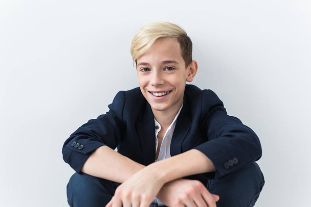 Attractive eleven year old boy with braces on his teeth. Dentistry and teenager concept. - Foto, Imagen