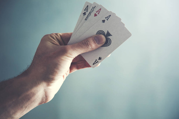 magician hand holding playing cards - Foto, imagen