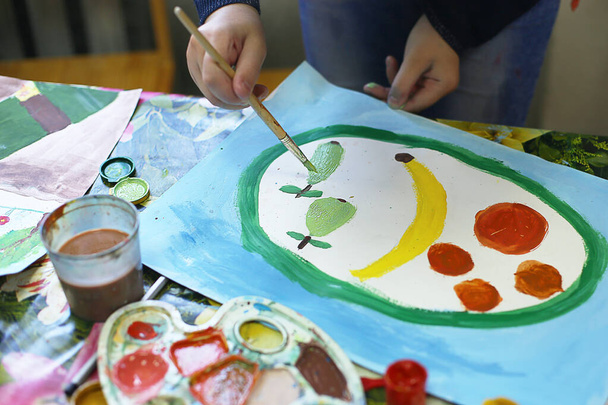 a lesson in an art school for children on paint, modeling and application, future artists create masterpieces - Photo, Image