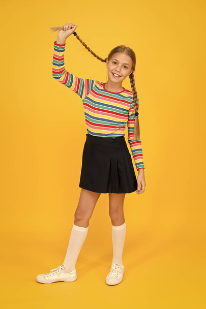 Cute child trendy and fancy. Little girl wearing rainbow clothes. Positivity concept. Happiness. Emotional kid. Fashion shop. Must have accessory. Modern fashion. Kid fashion. Girl long hair - Foto, Imagem