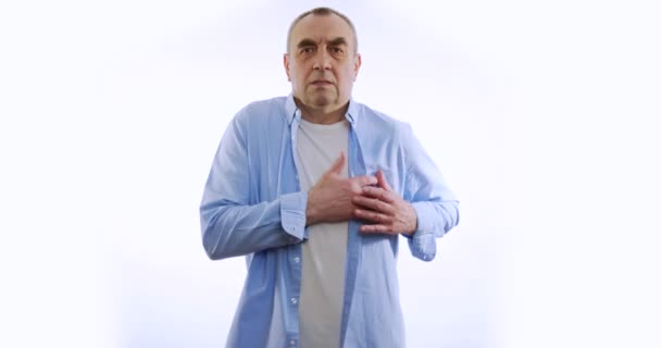 Elderly man having pain in chest, white background. - Footage, Video