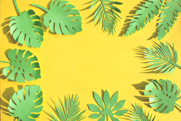 Green paper cutout tropical leaves.  - 写真・画像