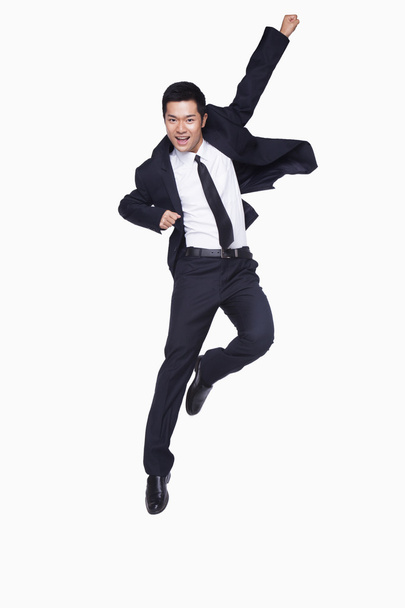 Jovem empresário pulando
 - Foto, Imagem