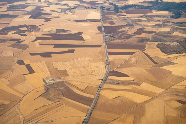 Aerial view of the Madrid region, outside the metropolitan area. Flying over agricultural fields and road. Spain - Valokuva, kuva