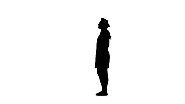 Schwarze Silhouette des Kochmädchens in Haube und Schürze steht isoliert im Profil auf weißem Hintergrund - Foto, Bild