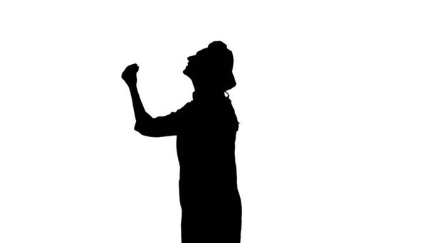 Portrait de fille cuisinière de silhouette noire en toque est gesticulant louant leurs plats sur fond blanc. Vue du profil
 - Photo, image