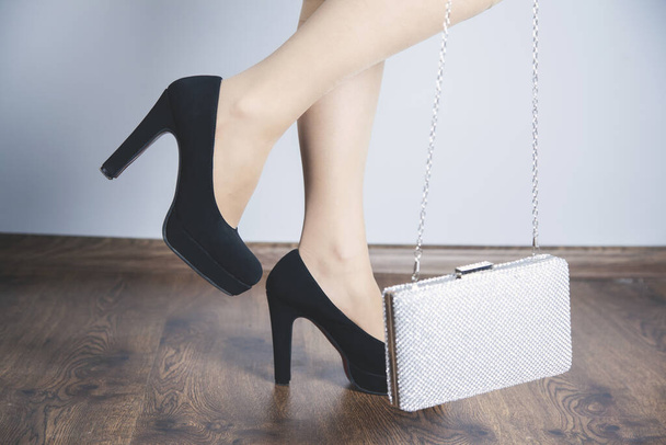 woman hand bag with shoes in studio - Foto, Imagem