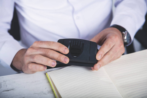 man hand stapler with document in the office - Fotoğraf, Görsel