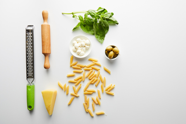 Flat lay with rolling pin, grater and ingredients on white  - Foto, Bild