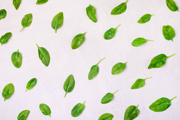 Fresh Spinach Leaves on Light Gray Background Vegetable Pattern Design Top View Horizontal - Photo, image