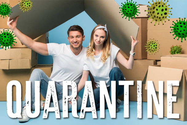 beautiful couple holding carton roof over heads while sitting on blue with cardboard boxes for relocation, quarantine and bacteria illustration  - Valokuva, kuva