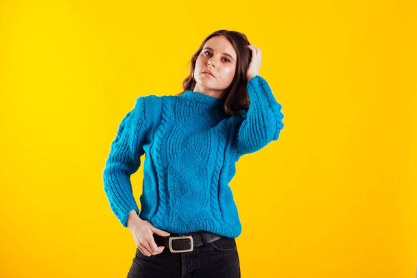 Beautiful fashionable brunette woman in blue sweater - Photo, Image