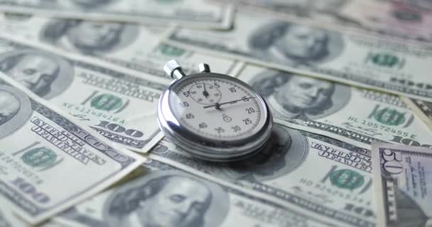 The stopwatch lies on the dollars. Time is money concept. - Footage, Video