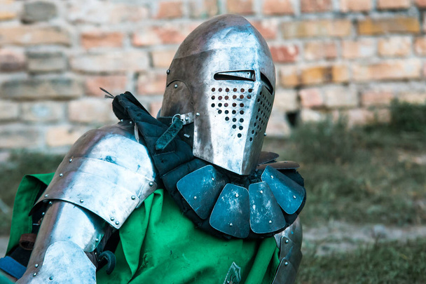 Medieval knight in armor. Green clothes. - Photo, Image