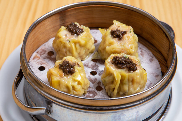 Ha-kao Chicken Dumplings dim sum in a bamboo steamer box, Chinese cuisine. - Фото, зображення