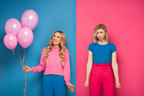 Smiling blonde girl holding balloons near sad sister on blue and pink background - Fotoğraf, Görsel