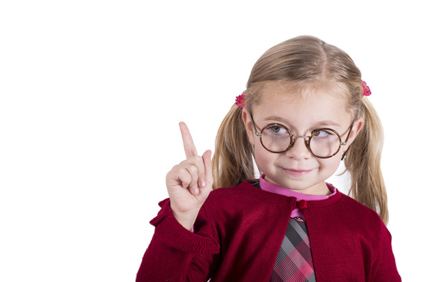 Close-up portrait of little girl wearing glasses - Foto, afbeelding