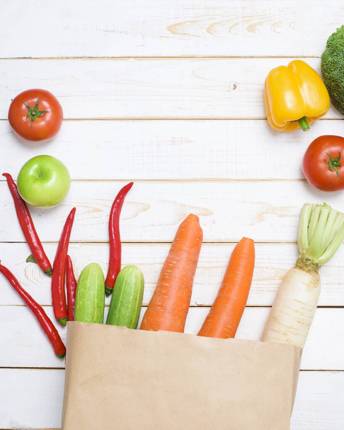  vegetables in grocery bag on white wood background - Photo, Image