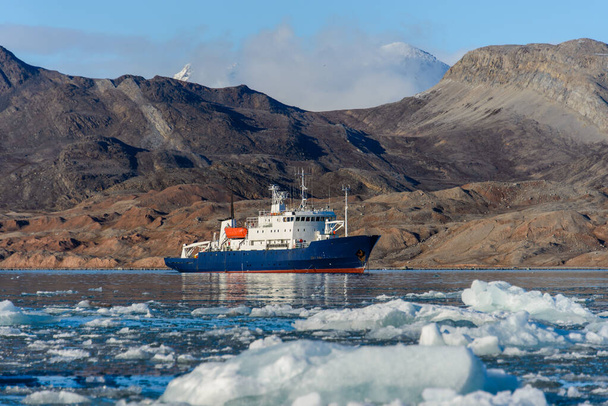 Expedition ship in Arctic sea, Svalbard. Passenger cruise vessel. Arctic and Antarctic cruise. - Photo, image